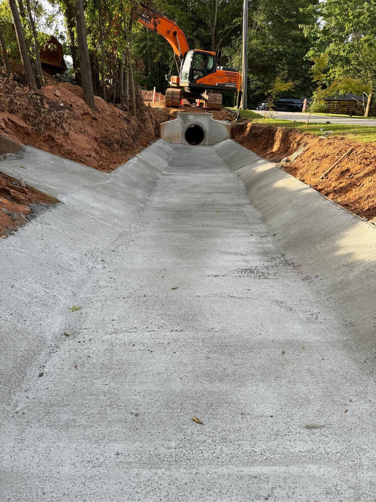 After — pristine finished concrete channel and driveway, S&V completed project