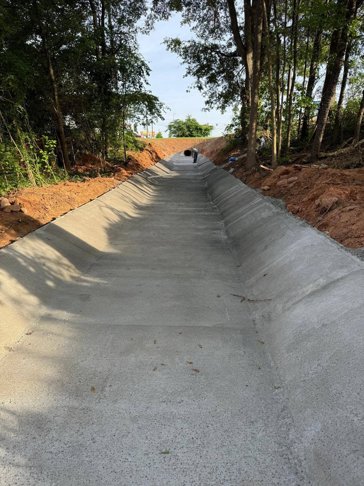 Finished concrete channel — S&V excavation and grading work